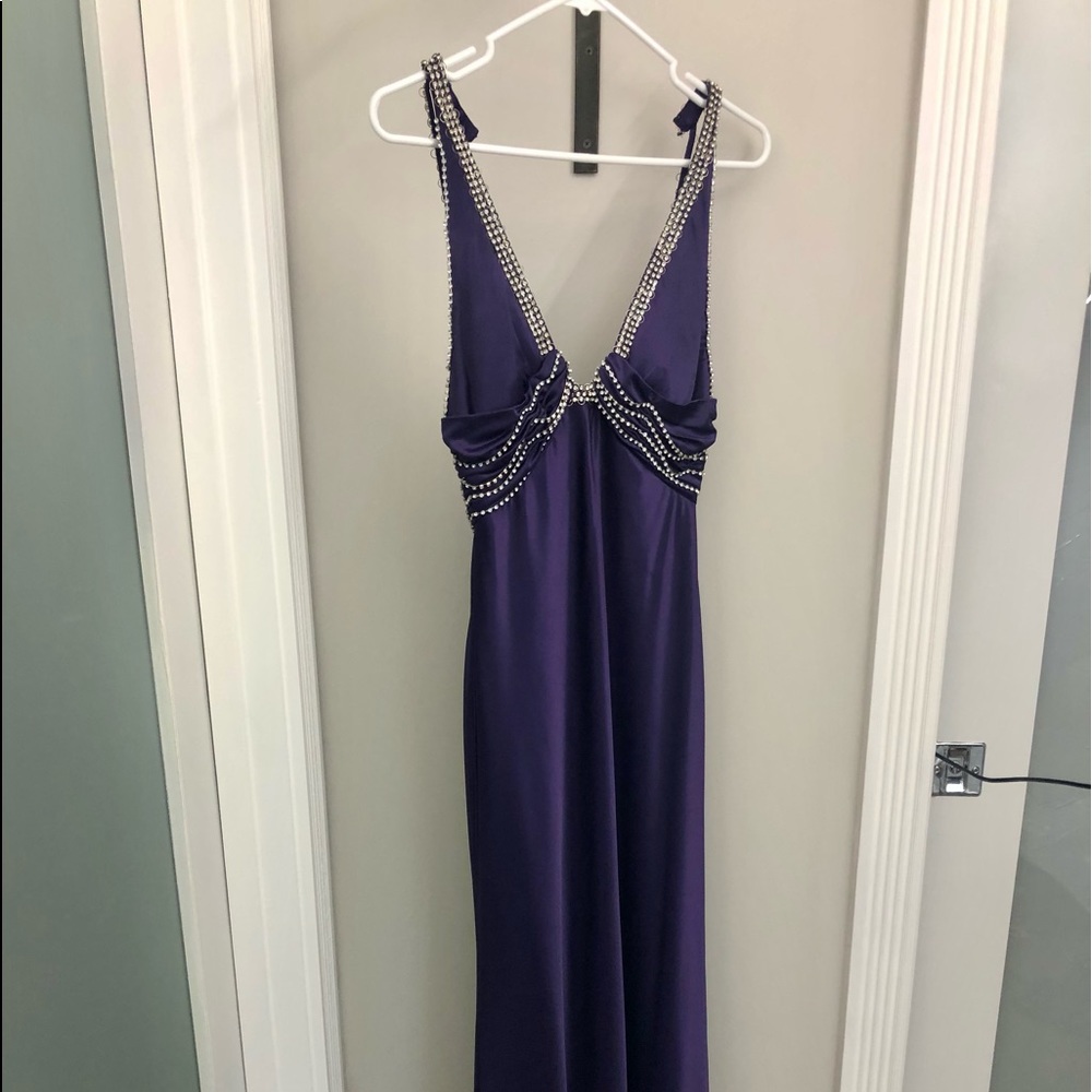 Long deep purple gown.
